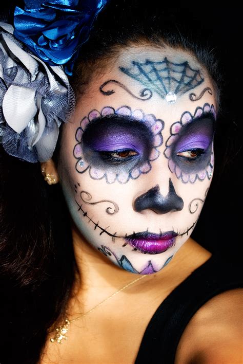 This Easy Purple Sugar Skull Makeup look is beautiful featuring a black and purple skull that is adorned with red, purple, and pink jewels and white pearls. This sugar skull makeup is perfect for wearing for Halloween or for Dia de Los Muertos (Day of the Dead) and is very easy for makeup beginners to create. Best of all, this sugar skull ... 